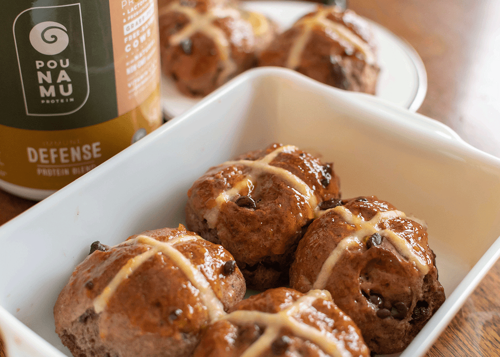Pounamu Protein freshly baked protein hot cross buns with chocolate chips.